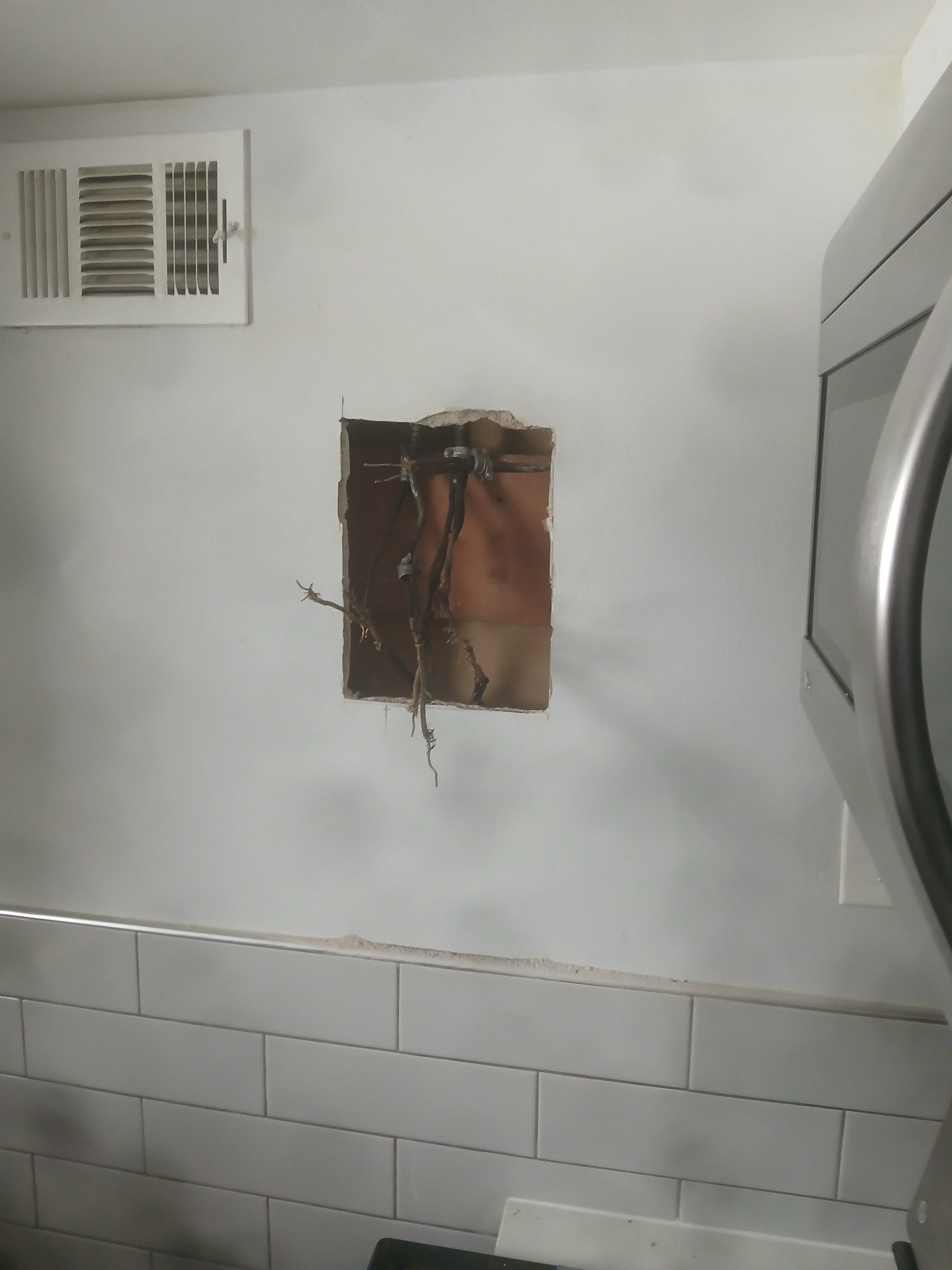 Before: exposed wiring and wall access